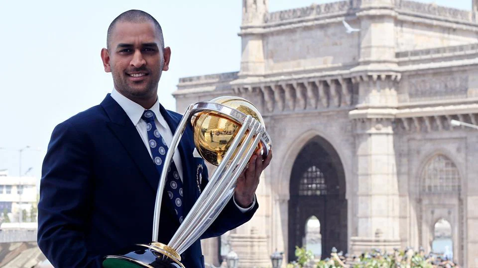 dhoni with 2011 world cup trophy